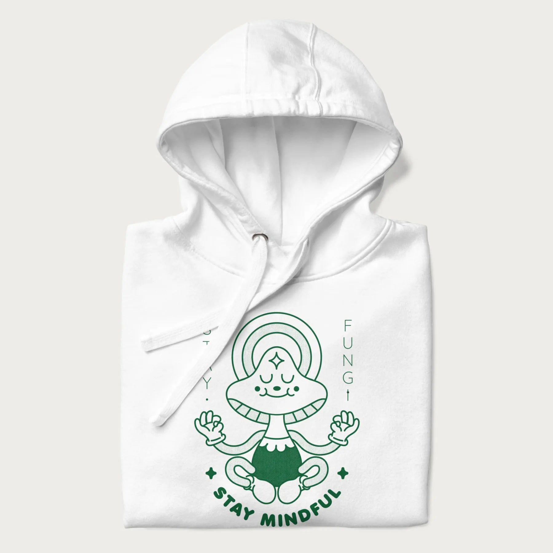 Folded white hoodie with a graphic of a meditating mushroom character and the words 'Stay Fungi' and 'Stay Mindful'.