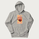Light grey hoodie with a graphic of a character with a mushroom cap playing a guitar and the text 'Stay Trippy Little Hippie.'
