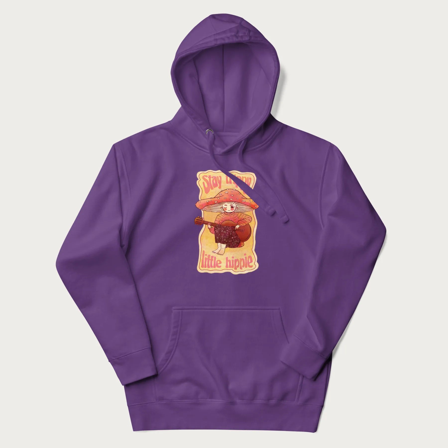 Purple hoodie with a graphic of a character with a mushroom cap playing a guitar and the text 'Stay Trippy Little Hippie.'
