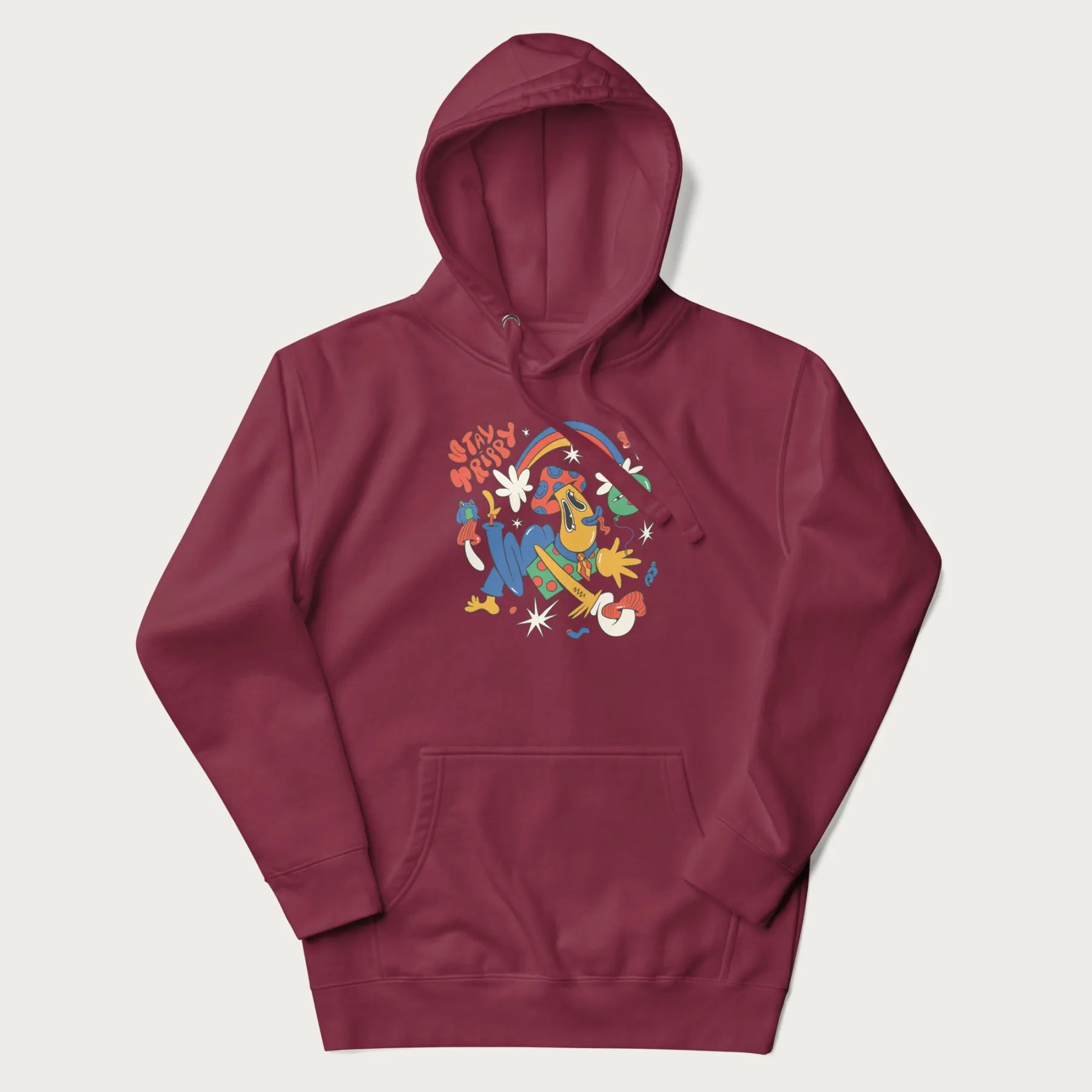 Maroon trippy hoodie featuring a colorful psychedelic design with playful characters and the text "Stay Trippy".