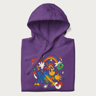 Folded purple trippy hoodie featuring a colorful psychedelic design with playful characters and the text "Stay Trippy".