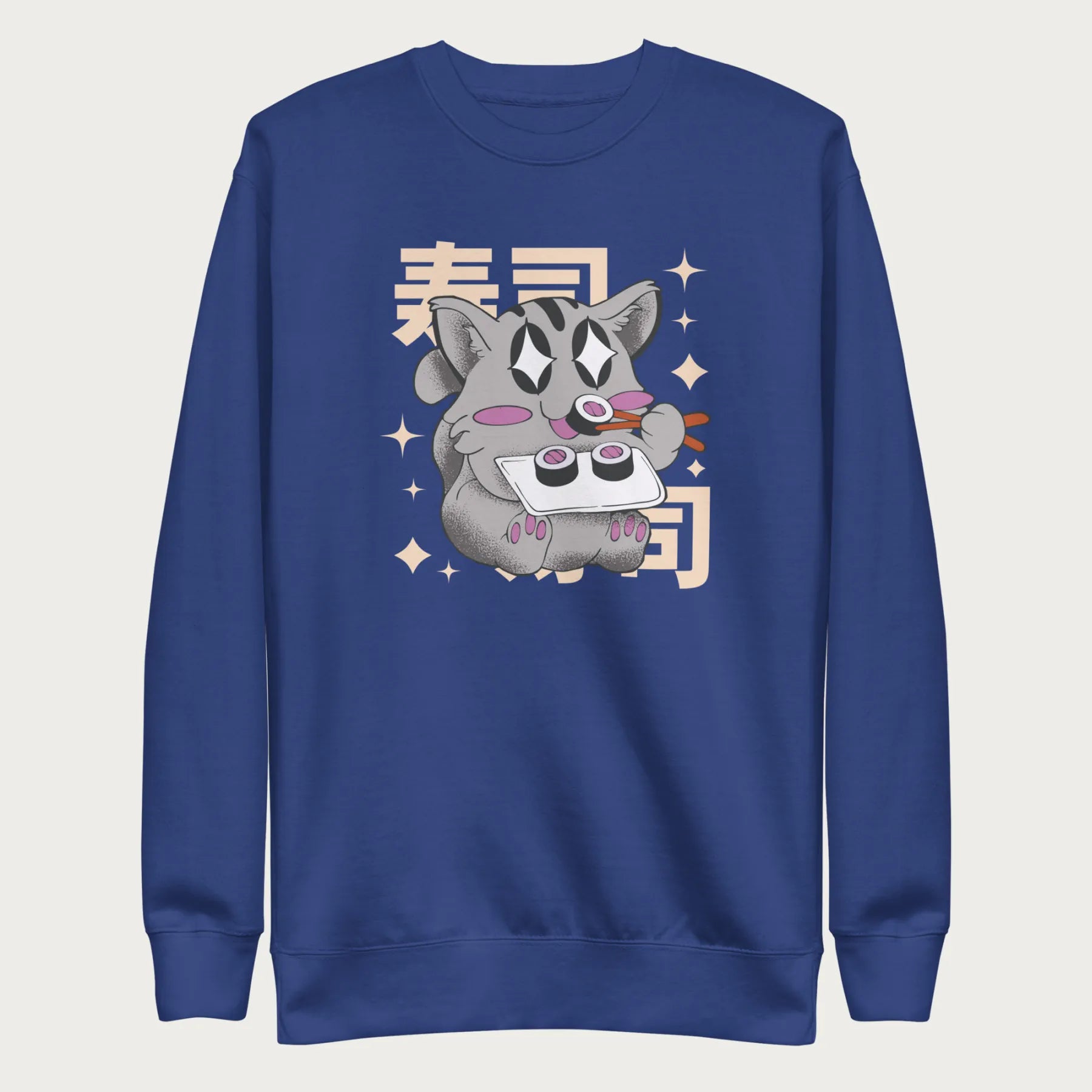 Folded royal blue sweatshirt with Japanese text and a kawaii graphic of a cat eating sushi.