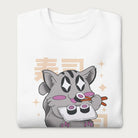 Folded white sweatshirt with Japanese text and a kawaii graphic of a cat eating sushi.