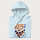 Folded light blue hoodie with Japanese graphic of a sushi monster over a burning city with Japanese text.