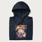 Folded navy blue hoodie with Japanese graphic of a sushi monster over a burning city with Japanese text.