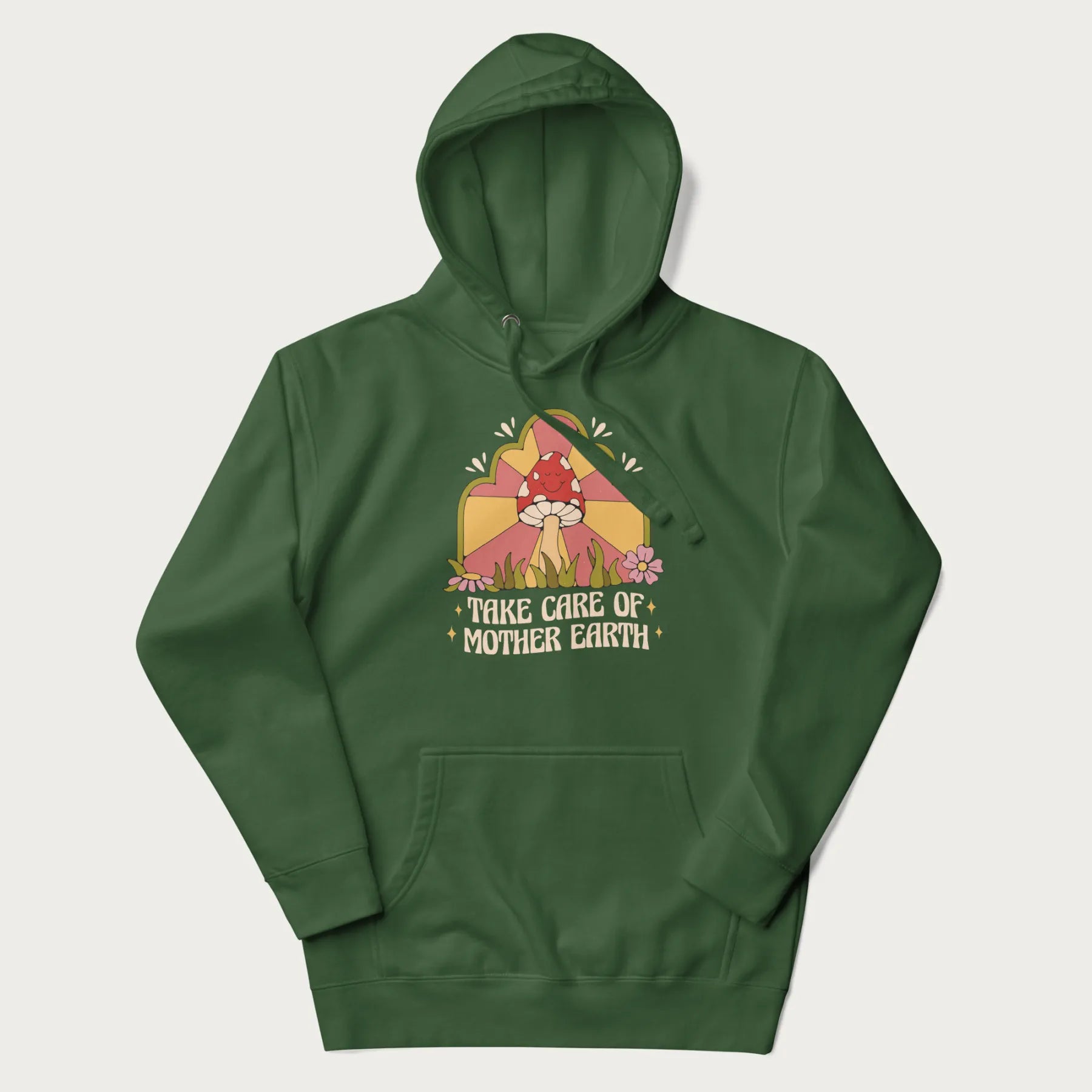 Forest green hoodie with a graphic of a happy red mushroom, sunburst background, and the text 'Take Care of Mother Earth'.