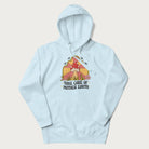 Light blue hoodie with a graphic of a happy red mushroom, sunburst background, and the text 'Take Care of Mother Earth'.