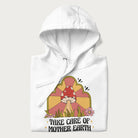 Folded white hoodie with a graphic of a happy red mushroom, sunburst background, and the text 'Take Care of Mother Earth'.