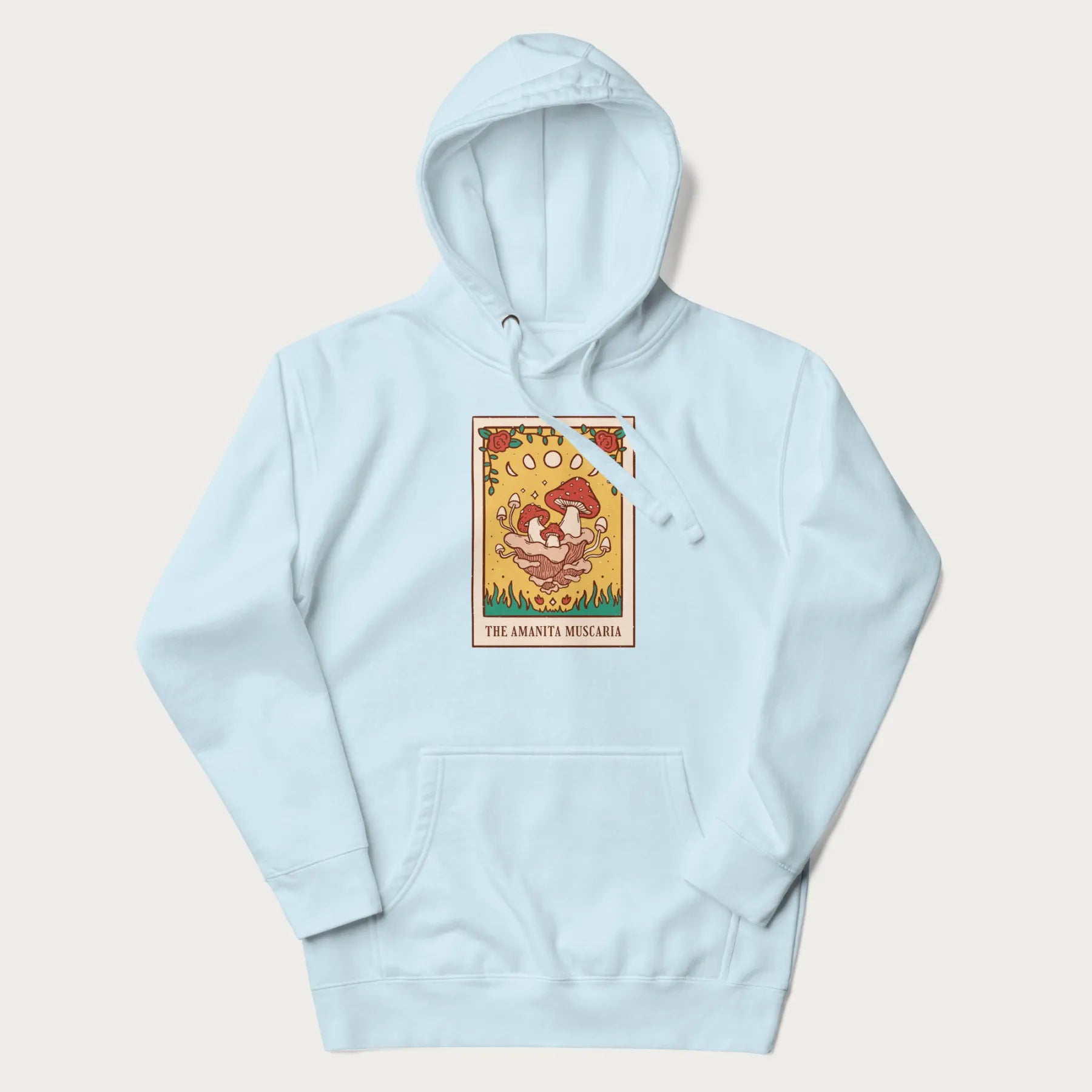 Light blue hoodie featuring a graphic of Amanita Muscaria mushrooms with floral accents and moon phases, resembling a tarot card.