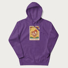 Purple hoodie featuring a graphic of Amanita Muscaria mushrooms with floral accents and moon phases, resembling a tarot card.