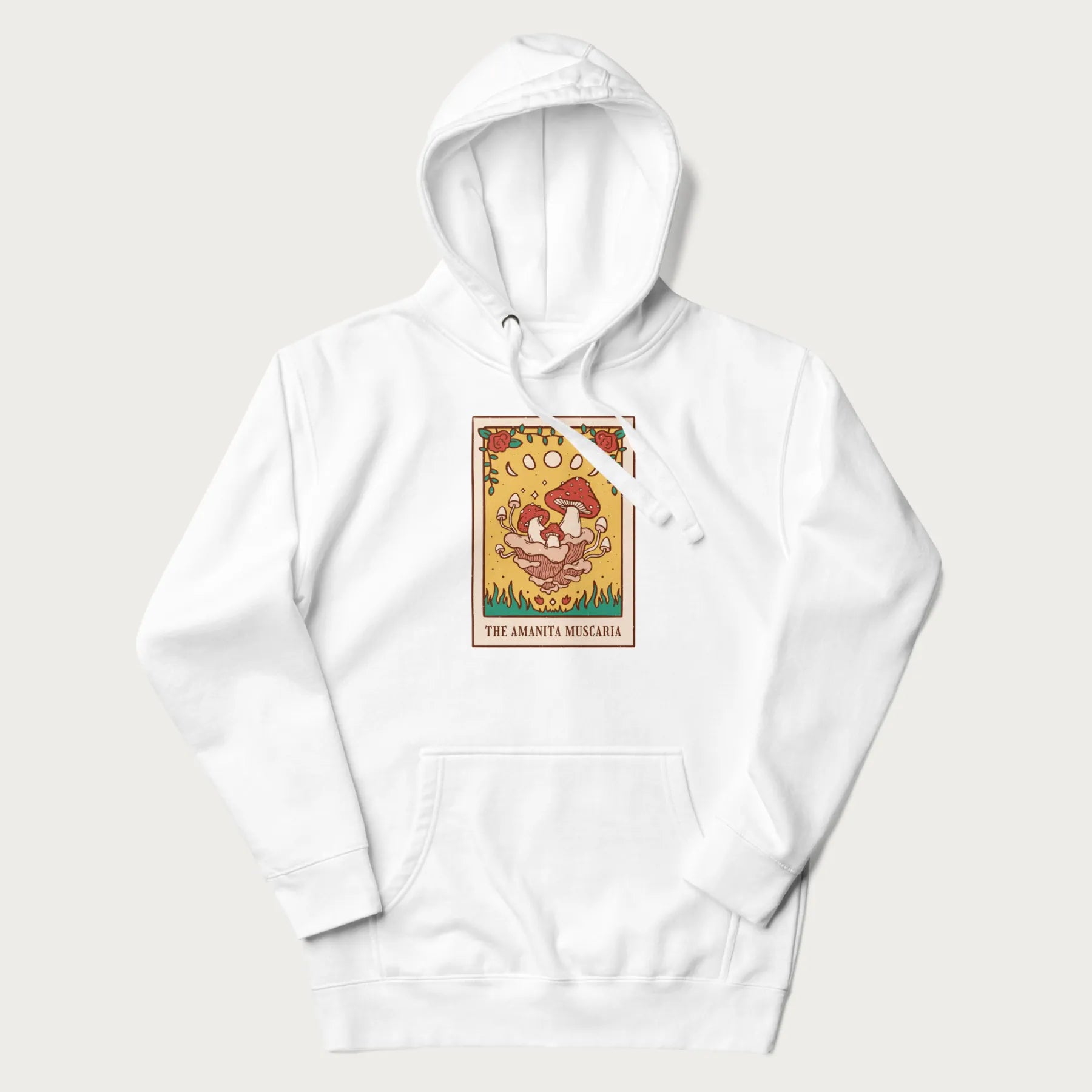 White hoodie featuring a graphic of Amanita Muscaria mushrooms with floral accents and moon phases, resembling a tarot card.