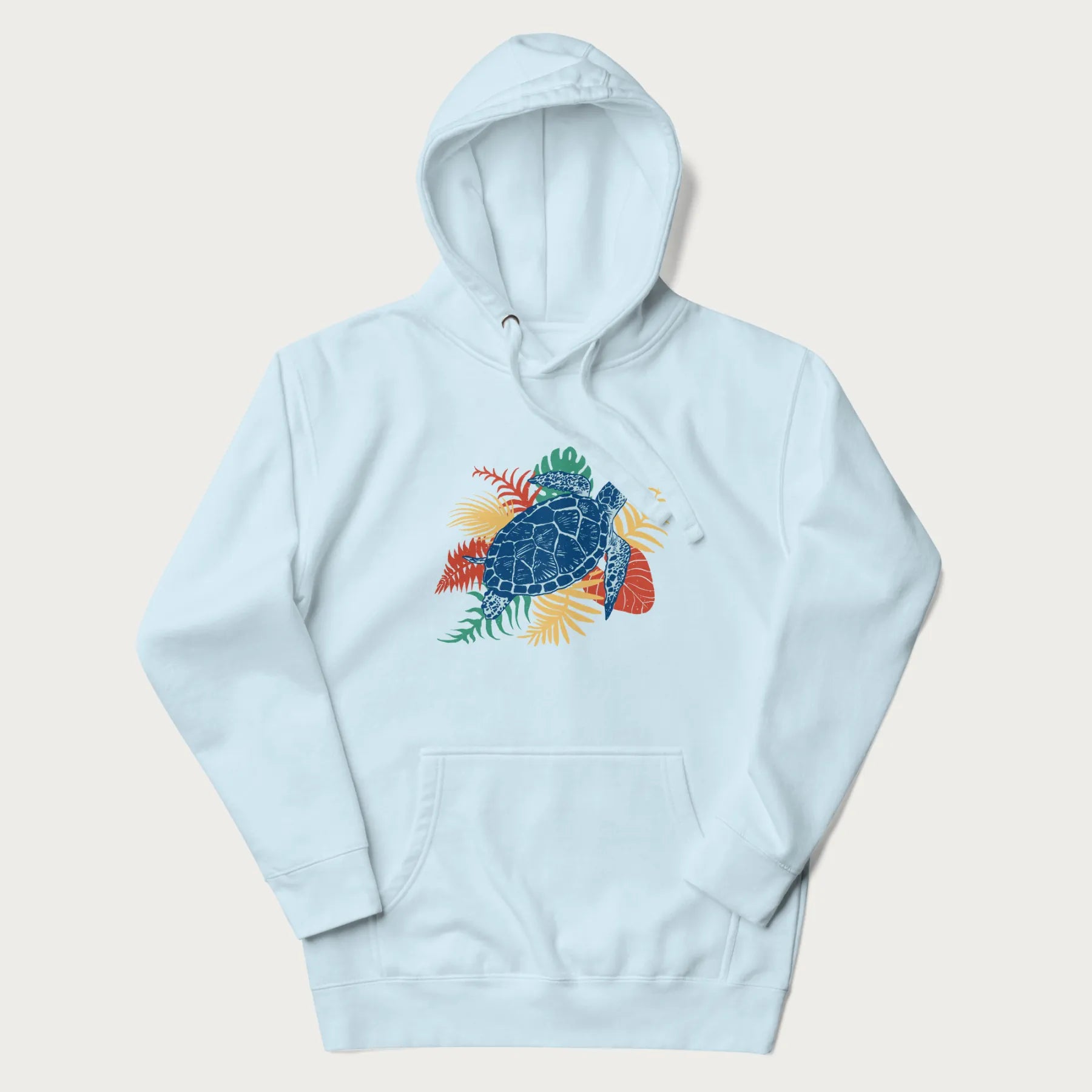 Light blue hoodie with a vibrant graphic of a blue sea turtle and colorful tropical leaves.