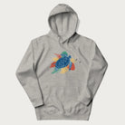 Light grey hoodie with a vibrant graphic of a blue sea turtle and colorful tropical leaves.