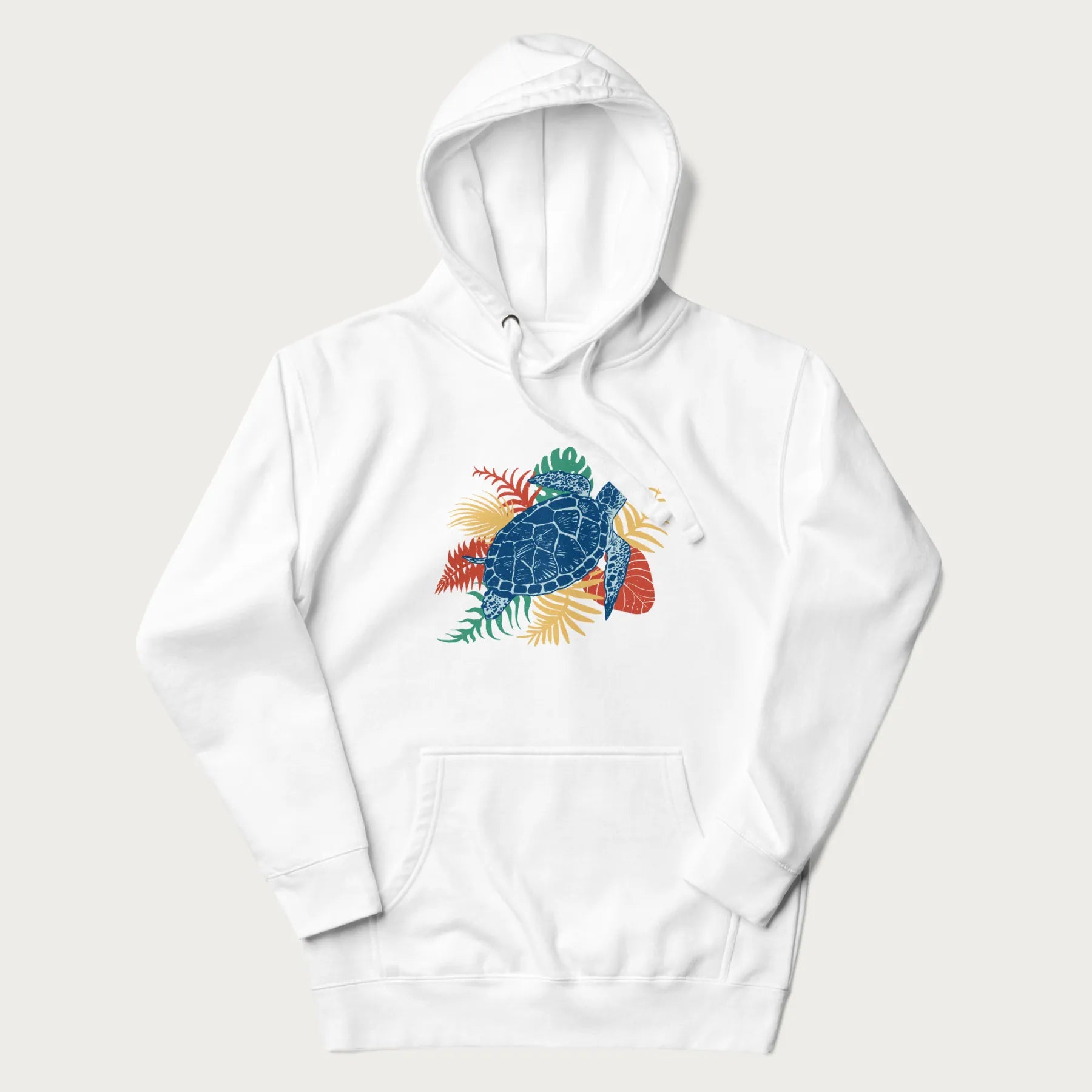 White hoodie with a vibrant graphic of a blue sea turtle and colorful tropical leaves.