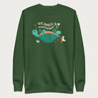 Forest green sweatshirt with a graphic of a turtle flipped on it's shell with the phrase 'We Shell Overcome.'