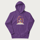 Purple hoodie with graphic of mystical mushrooms with an all-seeing eye and the text 'Wisdom Begins in Wonder' framed by a rainbow arch.