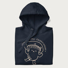 Folded navy blue hoodie with a cute champignon mushroom graphic and the text "You're a Real Champignon!"