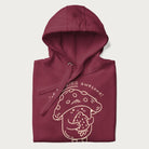 Folded maroon hoodie with a cute mushroom graphic and the text "You're FUNGING Awesome!"