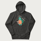 Dark grey hoodie with a cute turtle graphic and the text 'You're Shella Cute' above.