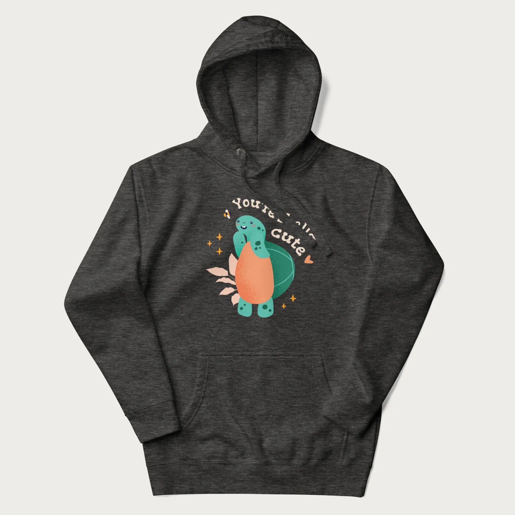 Dark grey hoodie with a cute turtle graphic and the text 'You're Shella Cute' above.