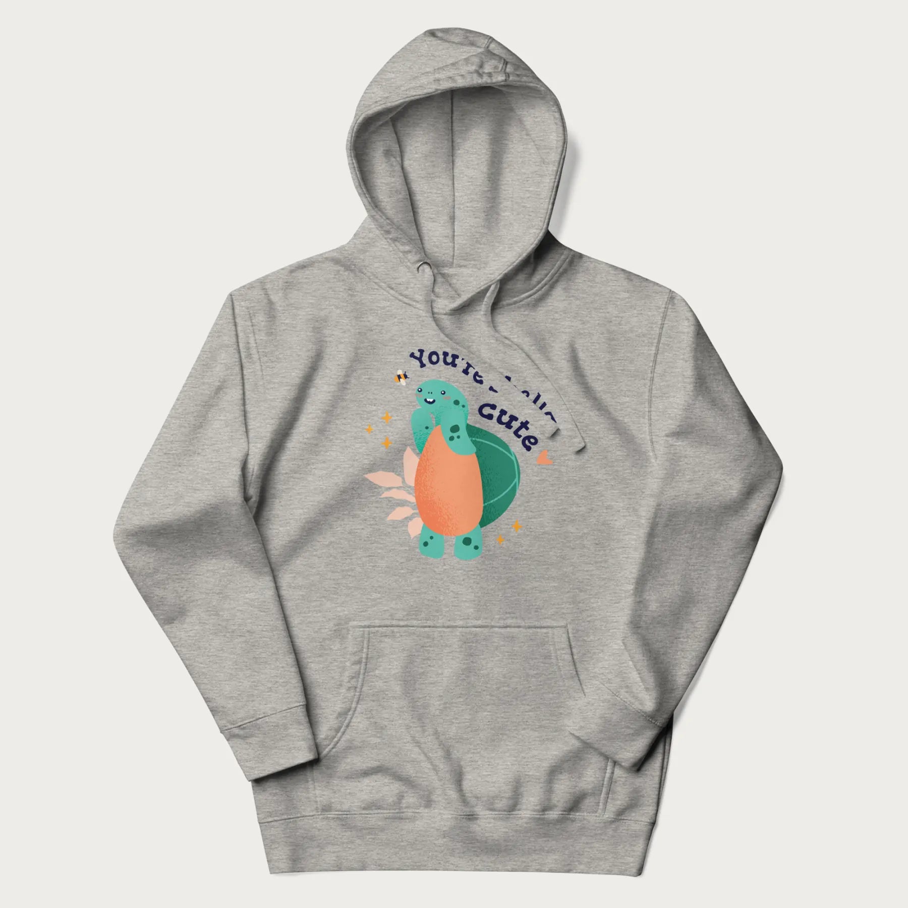 Light grey hoodie with a cute turtle graphic and the text 'You're Shella Cute' above.