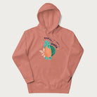 Light pink hoodie with a cute turtle graphic and the text 'You're Shella Cute' above.