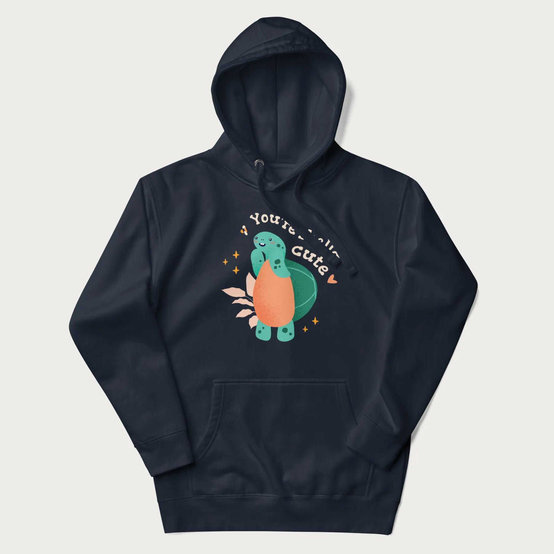 Navy blue hoodie with a cute turtle graphic and the text 'You're Shella Cute' above.