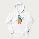 White hoodie with a cute turtle graphic and the text 'You're Shella Cute' above.