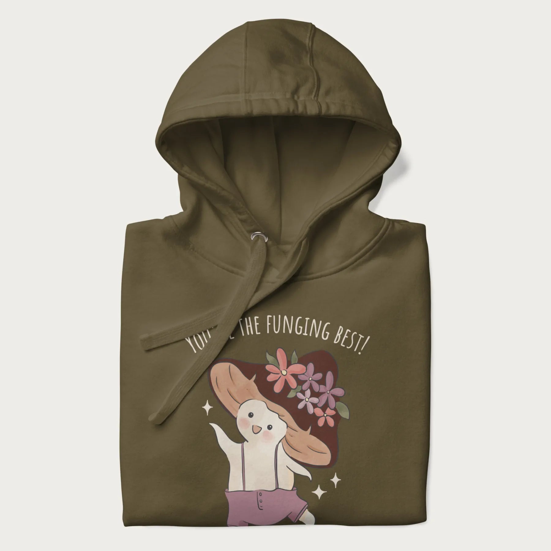 Folded military green hoodie with a cute mushroom character and the text 'You're the Funging Best' above.